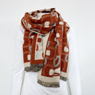 muster wollschal janine springstar gebissmotiv orange beige kleine fransen